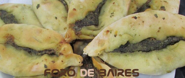 Puestos gastronómicos y espectáculos musicales en la Fiesta de La Empanada