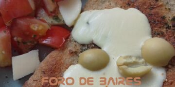 La tentación de disfrutar una rica milanesa a los cuatro quesos con aceitunas y guarnición a gusto